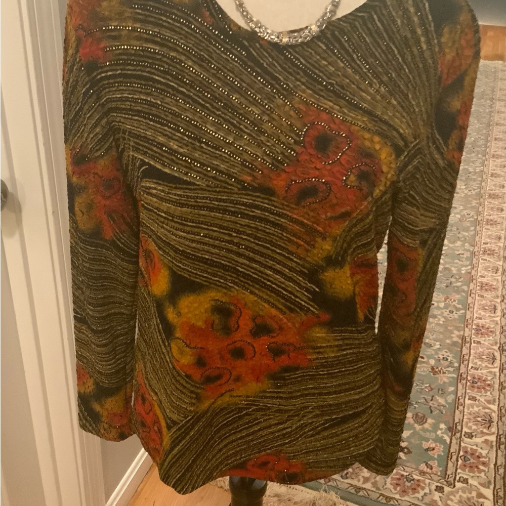 Chico’s lovely multicolored floral top size one/medium. Has shiny colored thread